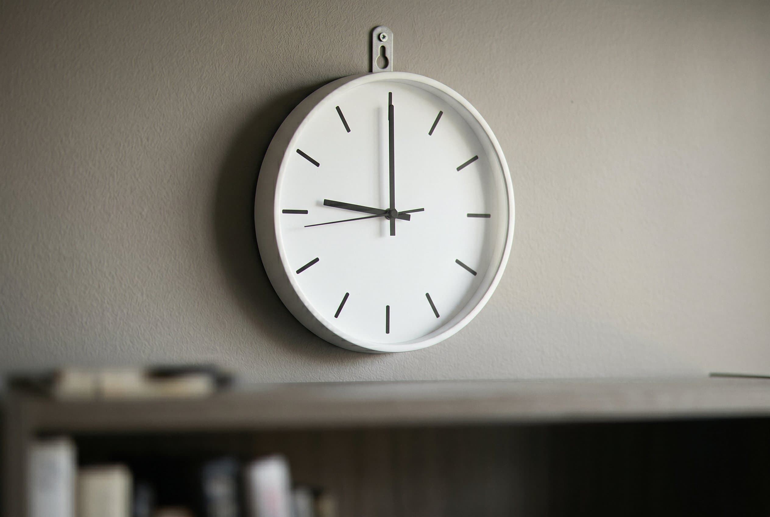 Office wall clock during legal consultation